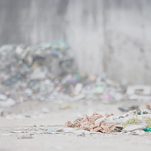 Extended Producer Responsibility Piles of discarded textiles on a beach